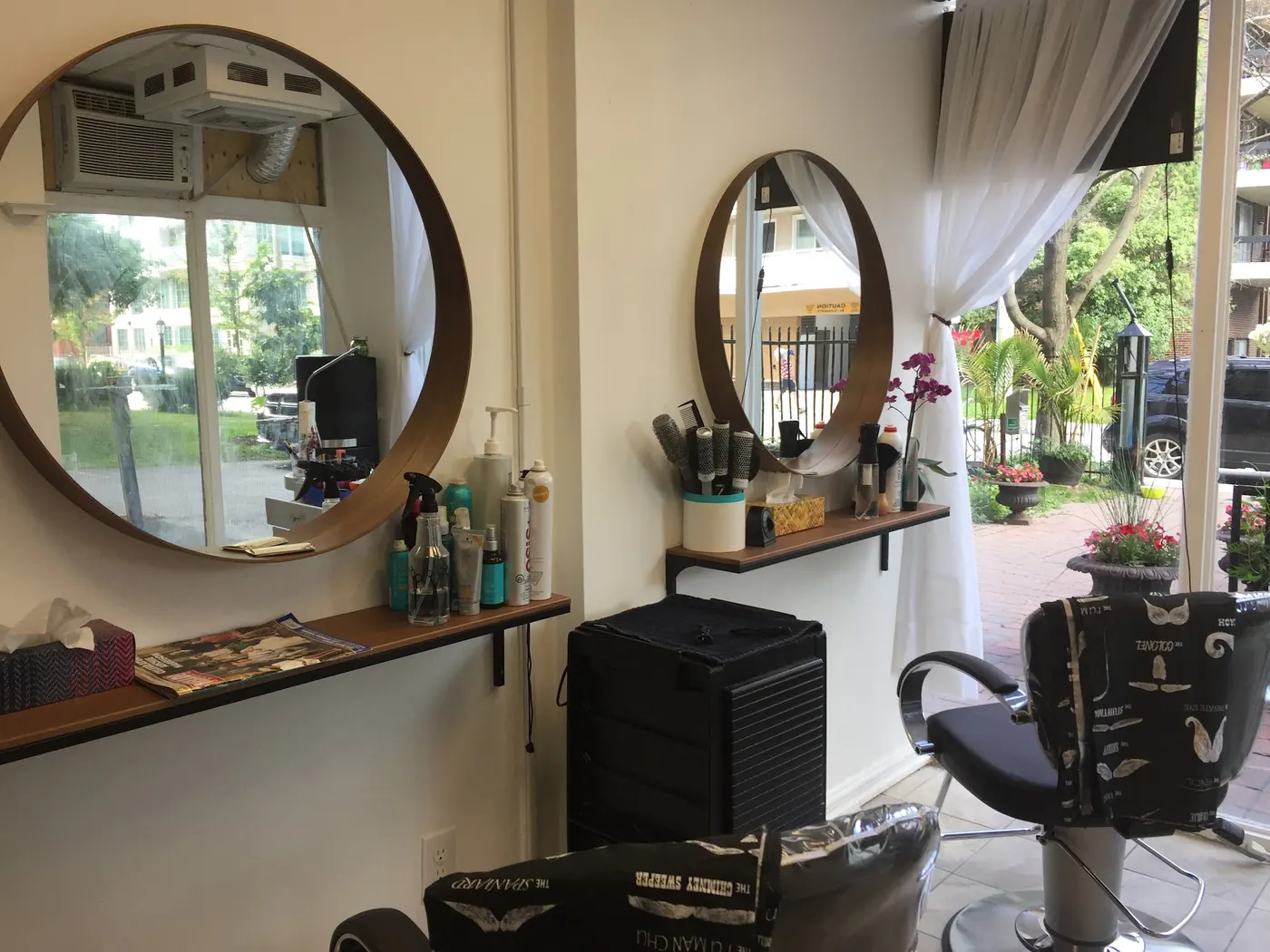 Inside Wendy's Studio: round mirrors, styling chairs and a bright window